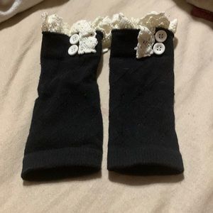 Black and cream color ruffle leg warmers